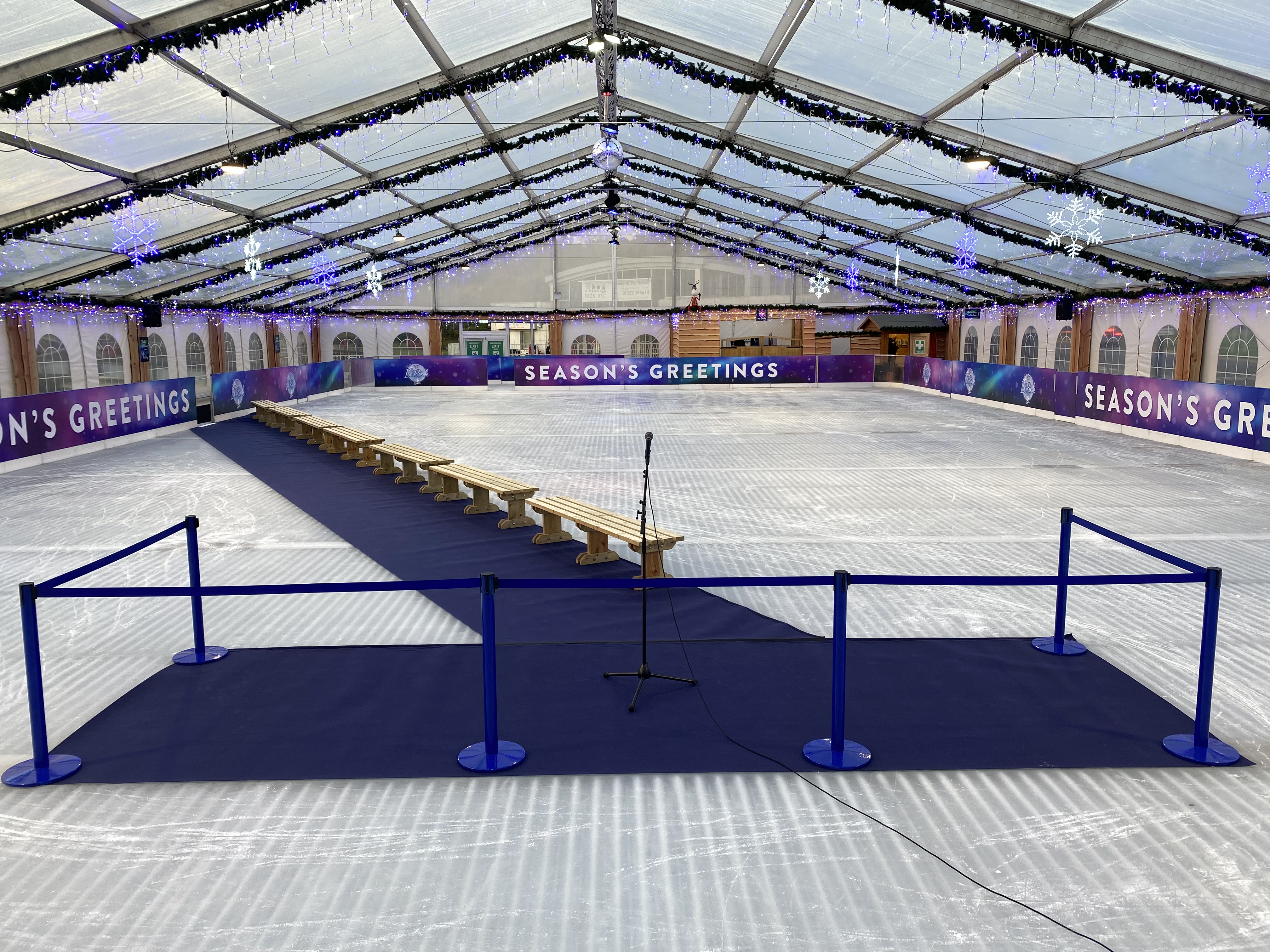 A blue carpet on the ice at Bluewater winter ice - ready for a presentation with microphone. 