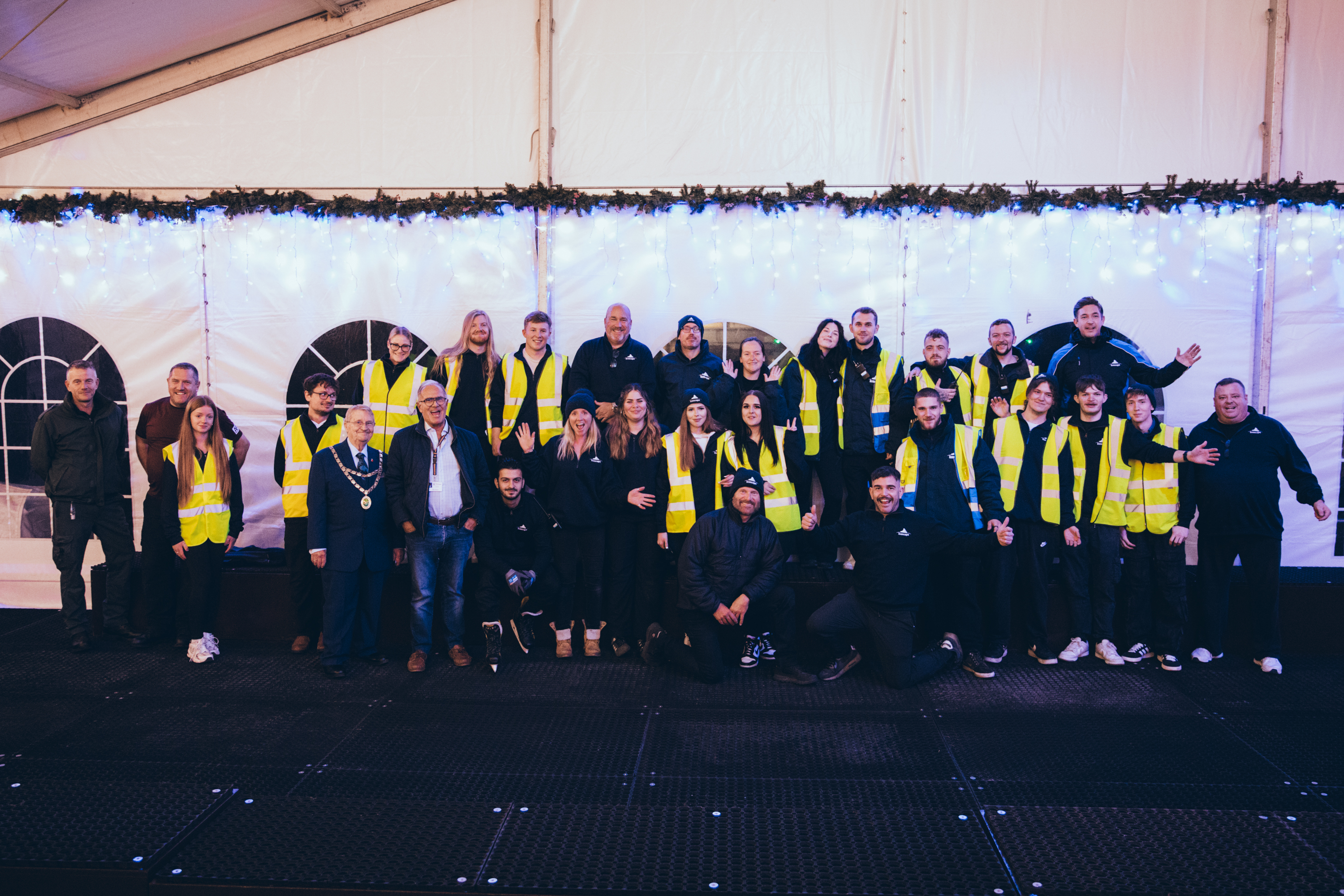 A group photo of some of the team at Icescape who provide temporary real ice rinks. 