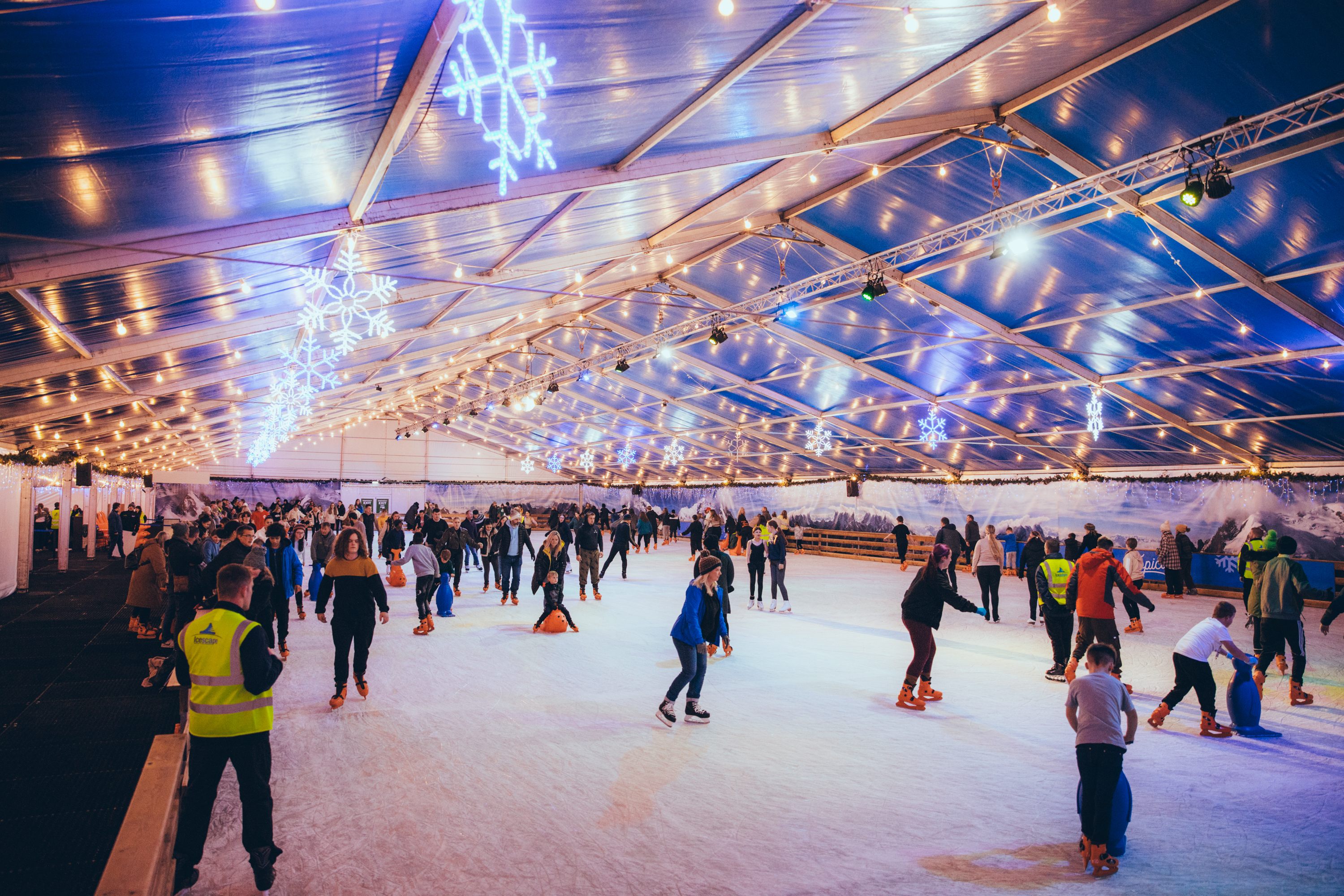 Ice skaters, skating and enjoying themselves on the ice at Icescape Tropicana. 